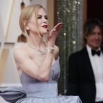 
              Nicole Kidman arrives at the Oscars on Sunday, March 27, 2022, at the Dolby Theatre in Los Angeles. Looking on in background is Keith Urban. (AP Photo/Jae C. Hong)
            