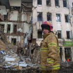 
              A Ukrainian firefighter works near a destroyed apartment building in Kharkiv, Ukraine, Wednesday, March 16, 2022. Both Russia and Ukraine projected optimism ahead of another scheduled round of talks Wednesday, even as Moscow's forces rained fire on Kyiv and other major cities in a bid to crush the resistance that has frustrated Kremlin hopes for a lightning victory. (AP Photo/Andrew Marienko)
            