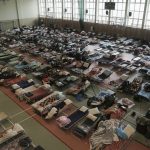 
              Hundreds of beds are placed inside a sports hall to accommodate Ukrainian refugees fleeing Russian invasion at the border crossing town of Medyka, Poland, on Tuesday, March 1, 2022. All day long, as trains and buses bring people fleeing Ukraine to the safety of Polish border towns, they carry not just Ukrainian fleeing a homeland under attack but large numbers of other citizens who had made Ukraine their home and whose fates too are now uncertain. (AP Photo/Visar Kryeziu)
            
