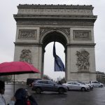 
              The European Union flag flies under the Arc de Triomphe to mark France's EU presidency and the EU Summit of Versailles, in Paris, France, Friday, March 11, 2022. European Union leaders have ruled out fulfilling Ukraine's demand for a fast-track integration with the bloc as they discussed ways to help the eastern country in its war against Russia. (AP Photo/Francois Mori)
            