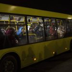 
              Displaced Ukrainians take a bus ride to Poland from Lviv train station in western Ukraine on Saturday, March 5, 2022. Russian troops took control of the southern port city of Kherson this week. Although they have encircled Kharkiv, Mykolaiv, Chernihiv and Sumy, Ukrainian forces have managed to keep control of key cities in central and southeastern Ukraine, Ukrainian President Volodymyr Zelenskyy said Saturday. (AP Photo/Bernat Armangue)
            