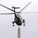 
              Marine One, with President Joe Biden aboard, approaches the Washington Monument as it lifts off from the South Lawn of the White House, Friday, March 18, 2022, in Washington. Biden is spending the weekend at his home in Rehoboth Beach, Del. (AP Photo/Patrick Semansky)
            
