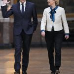 
              French President Emmanuel Macron and European Commission President Ursula von der Leyen arrive for a press conference after the EU summit at the Chateau de Versailles, Friday, March 11, 2022 in Versailles, west of Paris. The European Union says it will continue applying pressure on Russia by devising a new set of sanctions to punish Moscow for its invasion of Ukraine while stepping up military support for Kyiv. (AP Photo/Michel Euler)
            