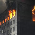 
              A building is engulfed in flames after shelling in Kyiv, Ukraine, Thursday, March 3, 2022. Russian forces have seized a strategic Ukrainian seaport and besieged another. Those moves are part of efforts to cut the country off from its coastline even as Moscow said Thursday it was ready for talks to end the fighting.  (AP Photo/Efrem Lukatsky)
            