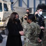 
              US Vice President Kamala Harris, center, meets with US and Polish troops at Warsaw Chopin International Airport, in Warsaw, Poland, Friday, March 11, 2022. (Saul Loeb/Pool Photo via AP)
            