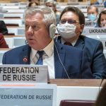 
              Russian ambassador Gennady Gatilov, left, and Ukraine's ambassador Yevheniia Filipenko, far right, listen to a speech, during the 49th session of the UN Human Rights Council about the Urgent Debate on the "situation of human rights in Ukraine stemming from the Russian aggression" at the European headquarters of the United Nations in Geneva, Switzerland, Thursday, March 3, 2022. (Martial Trezzini/Keystone via AP)
            