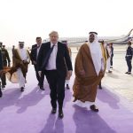 
              Britain's Prime Minister Boris Johnson, centre, arrives at Riyadh Airport, in Saudi Arabia, during a one-day visit to Saudia Arabia and the United Arab Emirates to strengthen ties with the Gulf nations, Wednesday March 16, 2022. (Stefan Rousseau/Pool Photo via AP)
            