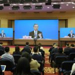 
              Chinese Foreign Minister Wang Yi speaks during a remote video press conference held on the sidelines of the annual meeting of China's National People's Congress (NPC) in Beijing, Monday, March 7, 2022. China's Foreign Minister on Monday called Russia Beijing's "most important strategic partner," amid its continued refusal to condemn the invasion of Ukraine. (AP Photo/Sam McNeil)
            