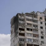
              An apartment building is damaged after parts of a Russian missile, shot down by Ukrainian air defense, landed in a residential area, according to authorities, in Kyiv, Ukraine, Thursday, March 17, 2022. Russian forces destroyed a theater in Mariupol where hundreds of people were sheltering Wednesday and rained fire on other cities, Ukrainian authorities said, even as the two sides projected optimism over efforts to negotiate an end to the fighting. (AP Photo/Vadim Ghirda)
            