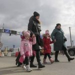 
              A family arrive at the border crossing in Medyka, Poland, Wednesday, March 2, 2022, after fleeing from the Ukraine. The U.N. refugee agency said Tuesday that around 660,000 people have fled Ukraine for neighboring countries since the Russian invasion began. (AP Photo/Visar Kryeziu)
            