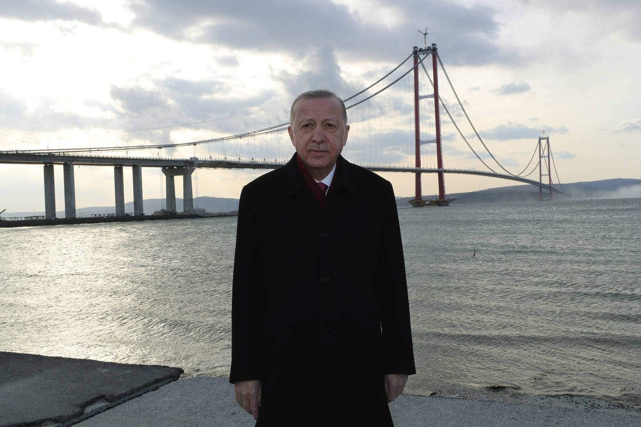 Turkey's President Recep Tayyip Erdogan poses for photos in front of the 1915 Canakkale Bridge, in ...