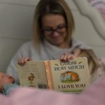 
              Tara Carpenter reads the book "Guess How Much I Love You" with her daughter, Alyssa Carpenter, 2, before her afternoon nap in Haymarket, Va., Friday, Jan. 28, 2022. Alyssa has had COVID-19 twice and suffers long-term symptoms. She is part of a NIH-funded multi-year study at Children's National Hospital to look at impacts of COVID-19 on children's physical health and quality of life. (AP Photo/Carolyn Kaster)
            