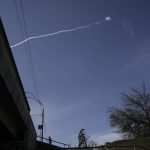 
              A missile trail is seen above Kyiv, Ukraine, Friday, March 11, 2022. A large scale evacuation operation of residents of a satellite area of capital Kyiv continued Friday, with more and more people deciding to leave areas now under Russian control.(AP Photo/Vadim Ghirda)
            