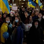 
              Ukranians and their supporters protest against Russia's invasion of Ukraine, in central Jerusalem, Monday, Feb. 28, 2022. (AP Photo/Maya Alleruzzo)
            
