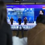 
              People watch a TV screen showing a news program reporting about North Korea's ICBM with an image of North Korean leader Kim Jong Un at a train station in Seoul, South Korea, Friday, March 25, 2022. North Korea said Friday it test-fired its biggest-yet intercontinental ballistic missile under the orders of leader Kim Jong Un, who vowed to expand the North's "nuclear war deterrent" while preparing for a "long-standing confrontation" with the United States. (AP Photo/Lee Jin-man)
            