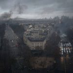 
              FILE - Avenues leading to the Arc de Triomphe are pictured from the top of the Arc de Triomphe on the Champs-Elysees avenue during a demonstration on Dec.1, 2018 in Paris. The Yellow Vest movement started in October 2018 among provincial workers camped out at traffic circles to protest a hike in fuel taxes, sporting the high-visibility vests all French drivers must keep in their cars for emergencies. It quickly spread to people across political, regional, social and generational divides angry at economic injustice and the way Macron was running France. French President Emmanuel Macron has formally announced that he will seek a second term in April’s presidential election. (AP Photo/Kamil Zihnioglu, File)
            