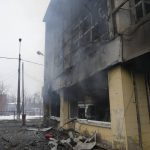 
              A journalist walks past a damaged gym following shelling in Kyiv, Ukraine, Wednesday, March 2, 2022. Russian forces have escalated their attacks on crowded cities in what Ukraine's leader called a blatant campaign of terror. (AP Photo/Efrem Lukatsky)
            