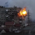 
              An explosion is seen in an apartment building after Russian's army tank fires in Mariupol, Ukraine, Friday, March 11, 2022. (AP Photo/Evgeniy Maloletka)
            