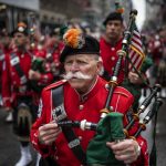 Bagpipers pay respect during a moment of silence outside St Patrick's Cathedral to "Mark the 20th anniversary of 9/11 and the victims of the pandemic." during the St. Patrick's Day Parade, Thursday, March 17, 2022, in New York. St. Patrick's Day celebrations across the country are back after a two-year hiatus, including the nation's largest in New York City, in a sign of growing hope that the worst of the coronavirus pandemic may be over. (AP Photo/Eduardo Munoz Alvarez)