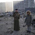 
              People look at the destruction caused after shelling of a shopping center, in Kyiv, Ukraine, Monday, March 21, 2022. (AP Photo/ (AP Photo/Rodrigo Abd)
            