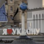 
              A crow flies backdropped by an "I love Ukraine" sign downtown Kyiv, Ukraine, Wednesday, March 16, 2022, as authorities declared a 35 hour curfew in the Ukrainian capital. Both Russia and Ukraine projected optimism ahead of another scheduled round of talks Wednesday, even as Moscow's forces rained fire on Kyiv and other major cities in a bid to crush the resistance that has frustrated Kremlin hopes for a lightning victory. (AP Photo/Vadim Ghirda)
            