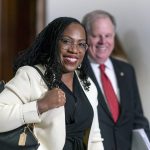 
              FILE - Supreme Court nominee Ketanji Brown Jackson smiles as she arrives for a meeting with Sen. Ben Sasse, R-Neb., a member of the Judiciary Committee, at the Capitol in Washington, March 3, 2022. Former Alabama Sen. Doug Jones has guided Jackson through the process of courting senators and preparing for her confirmation hearing that opens Monday. (AP Photo/J. Scott Applewhite, File)
            