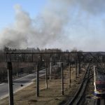 
              A cloud of smoke raises after an explosion in Lviv, Western Ukraine, Friday, March 18, 2022. The mayor of Lviv says missiles struck near the city's airport early Friday. (AP Photo/Bernat Armangue)
            