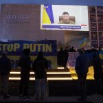 
              People gather in Habima Square in Tel Aviv, Israel, to watch Ukrainian President Volodymyr Zelenskyy in a video address to the Knesset, Israel's parliament, Sunday, March 20, 2022. (AP Photo/Maya Alleruzzo)
            