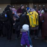 
              Families arrive at Kyiv's train station after leaving their homes in Chernihiv, Ukraine, through a humanitarian corridor, Monday, March 21, 2022. (AP Photo/Rodrigo Abd)
            