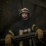 
              A Ukrainian firefighter looks inside a large food products storage facility which was destroyed by an airstrike in the early morning hours on the outskirts of Kyiv, Ukraine, Sunday, March 13, 2022. Waves of Russian missiles pounded a military training base close to Ukraine's western border with NATO member Poland, killing 35 people, following Russian threats to target foreign weapon shipments that are helping Ukrainian fighters defend their country against Russia's grinding invasion.(AP Photo/Vadim Ghirda)
            