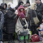 
              People who left Ukraine, wait for a bus to take them to the train station in Przemysl, at the border crossing in Medyka, Poland, Friday, March 4, 2022. More than 1 million people have fled Ukraine following Russia's invasion in the swiftest refugee exodus in this century, the United Nations said Thursday. (AP Photo/Visar Kryeziu)
            