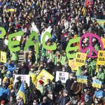 
              People take part in a protest against the Ukraine conflict in Hamburg, Germany, Sunday, March 13, 2022.  (Daniel Bockwoldt/dpa via AP)
            