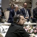 
              In this image taken from a video provided by the Turkish Presidency, Russian Roman Abramovich, top center, 3rd from right, listens to Turkish President Recep Tayyip Erdogan during the Russian and Ukrainian delegations meeting for talks in Istanbul, Turkey, Tuesday, March 29, 2022. Erdogan called for a cease-fire as the Russian and Ukrainian delegations resumed their two days of talks in Istanbul. (Turkish Presidency via AP)
            