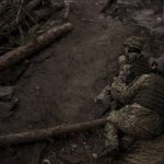 
              Ukrainian soldiers take cover from incoming artillery fire in Irpin, the outskirts of Kyiv, Ukraine, Sunday, March 13, 2022. (AP Photo/Felipe Dana)
            