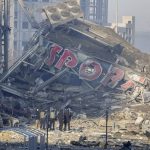 
              People examine the damage after shelling of a shopping center, in Kyiv, Ukraine, Monday, March 21, 2022. Eight people were killed in the attack. (AP Photo/ (AP Photo/Efrem Lukatsky)
            