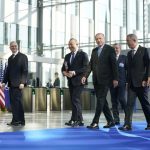 
              Turkish President Recep Tayyip Erdogan, center, arrives at NATO Headquarters for meetings with NATO allies about the Russian invasion of Ukraine, Thursday, March 24, 2022, in Brussels. (AP Photo/Evan Vucci)
            