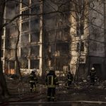 
              Firefighters work at the scene of an apartment building bombing in Kyiv, Ukraine, Tuesday, March 15, 2022. (AP Photo/Felipe Dana)
            