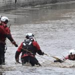 
              A Los Angeles Fire Department rescue crew pull a dog from the LA river in the Studio City section of Los Angeles on Monday, March 28, 2022. Two people and a dog were rescued from a rain-swollen Southern California river Monday as a vigorous late-season storm moved slowly through the state, bringing heavy showers and snow. A helicopter rescue crew pulled the dog's owner, a woman, from the rushing Los Angeles River, in the San Fernando Valley, around 2:40 p.m. But the dog slipped away and continued for more than an hour down the river, which runs through an inaccessible channel with high concrete walls for several miles. (AP Photo/Richard Vogel)
            