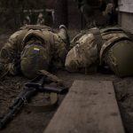 
              Ukrainian soldiers take cover from incoming artillery fire in Irpin, the outskirts of Kyiv, Ukraine, Sunday, March 13, 2022. (AP Photo/Felipe Dana)
            