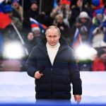 
              Russian President Vladimir Putin delivers his speech at a concert marking the eighth anniversary of the referendum on the state status of Crimea and Sevastopol and its reunification with Russia, in Moscow, Russia, Friday, March 18, 2022. (Sergei Guneyev/Sputnik Pool Photo via AP)
            