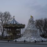 
              FILE - The monument of the Duke of Richelieu, is covered with sandbags next to a carousel, in Odesa, Ukraine, on March 24, 2022. The Black Sea port is mining its beaches and rushing to defend itself from a Mariupol-style fate. Some Western officials believe the city, which is dear to Ukrainians' hearts, could be next. (AP Photo/Petros Giannakouris, File)
            