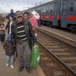 
              Refugees fleeing the war from neighboring Ukraine walk on a platform after disembarking from a train in Zahony, Hungary, Wednesday, March 2, 2022. Some of Ukraine’s most vulnerable citizens have reached safety in Poland through an effort of solidarity and compassion that transcended borders and raised a powerful counterpoint to war. On Wednesday, a train pulled into the station in Zahony, Hungary carrying some 200 people with severe physical and mental disabilities. The refugees, most of them children, were residents of two orphanages for the disabled in Ukraine’s capital of Kyiv that were evacuated as Russian forces battered the city. (AP Photo/Balazs Kaufmann)
            