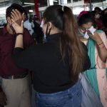
              An Indian student, who was evacuated from Ukraine, comforts her uncle as they meet upon her arrival at the Indira Gandhi International Airport in New Delhi, India, Friday, March 11, 2022. Hundreds of Indian medical students stuck in bunkers in one of the worst-hit north-eastern Ukrainian city of Sumy returned home Friday. (AP Photo/Altaf Qadri)
            