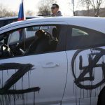 
              A sticker with a letter Z is seen on a car during a rally in support of Russia in Belgrade, Serbia, Sunday, March 13, 2022. Despite formally seeking EU membership, Serbia has refused to introduce international sanctions against its ally Russia. EU officials have repeatedly warned Serbia that it will have to align itself with the bloc's foreign policies if it wants to join. (AP Photo/Darko Vojinovic)
            