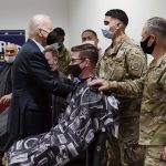 
              President Joe Biden visits with members of the 82nd Airborne Division at the G2A Arena, Friday, March 25, 2022, in Jasionka, Poland. (AP Photo/Evan Vucci)
            