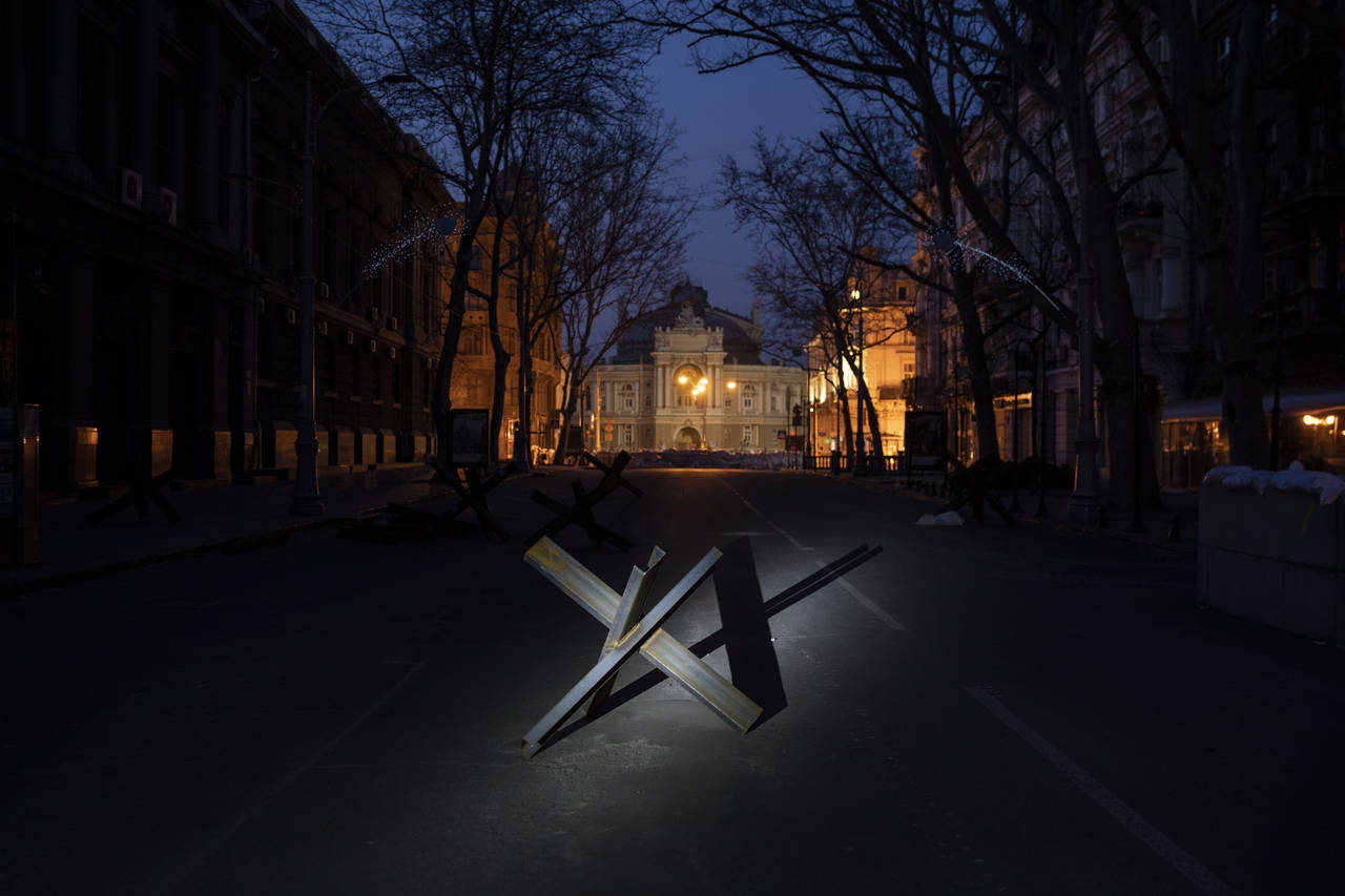 A barricade is placed on a street in front of the National Academic Theatre of Opera and Ballet bui...