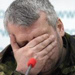 
              A captured Russian air force officer whose jets was shot down by Ukrainian forces reacts during a press conference in the Interfax news agency in Kyiv, Ukraine, Friday, March 11, 2022. (AP Photo/Efrem Lukatsky)
            