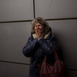 
              Natalia, 57, cries as she says goodbye to her daughter and grandson on a train to Lviv at the Kyiv station, Ukraine, Thursday, March 3. 2022. (AP Photo/Emilio Morenatti)
            