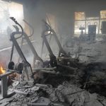 
              A view of smoke from inside a damaged gym following shelling in Kyiv, Ukraine, Wednesday, March 2, 2022. Russian forces have escalated their attacks on crowded cities in what Ukraine's leader called a blatant campaign of terror. (AP Photo/Efrem Lukatsky)
            