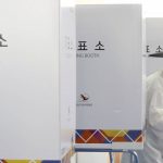 
              A South Korean Confucian scholar exits out to cast his vote for presidential election at a local polling station in Nonsan, South Korea, Wednesday, March 9, 2022. South Koreans were voting for a new president Wednesday, with an outspoken liberal ruling party candidate and a conservative former prosecutor considered the favorites in a tight race that has aggravated domestic divisions. (Kang Jong-min/Newsis via AP)
            